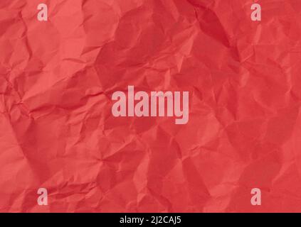 Wrinkled sheet of red, paper. Textured backdrop. Stock Photo