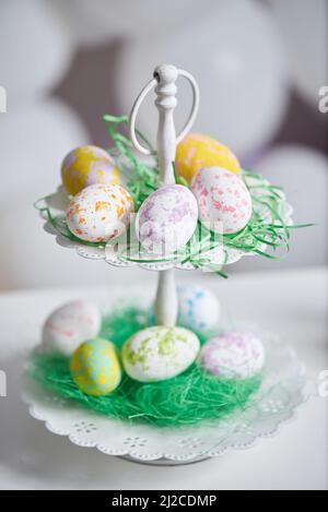 Easter eggs in a double plate on a table with a copy space Stock Photo