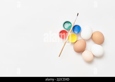 Chicken eggs and paints Stock Photo
