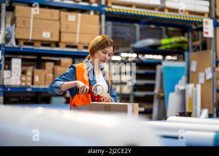 Young woman working in an industrial place of work Stock Photo