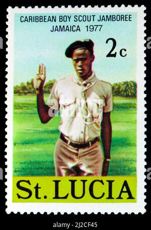 MOSCOW, RUSSIA - MARCH 13, 2022: Postage stamp printed in Saint Lucia shows Boy Scout, Carribean Boy Scout Jamboree - Jamaica 1977 serie, circa 1977 Stock Photo