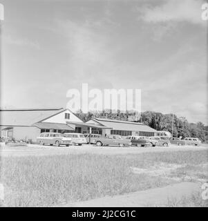 The parking lot of the Zanderij airport in Suriname ca. October 1, 1955 Stock Photo