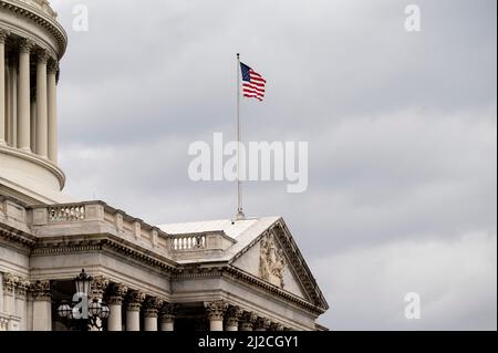 Washington, DC, USA. 31st Mar, 2022. March 31, 2022 - Washington, DC, United States: American flag flying above the U.S. Capitol. (Credit Image: © Michael Brochstein/ZUMA Press Wire) Stock Photo
