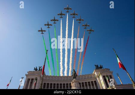 Rome, Italy 02/06/2015: Aircrafts of the Italian Air Force aerobatic unit 'Frecce Tricolori' leave smoke trails in the colours of the Italian national flag over Rome, on June 2, 2015, as part of the ceremonies marking Italian Republic Day. ©Andrea Sabbadini Stock Photo