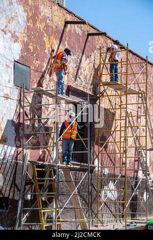 A group of Mexican construction workers prepping a home for painting. San Miguel de Allende, Guanajuato, Mexico Stock Photo