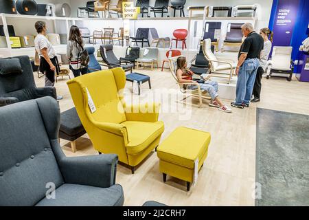Miami Florida IKEA home goods furnishings accessories furniture decor shopping shoppers inside interior display sale chairs family looking trying Stock Photo