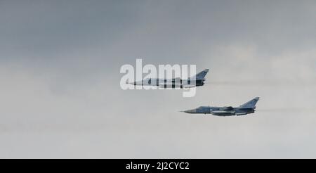 Su-24 Russian bomber with variable sweep wing in flight Stock Photo