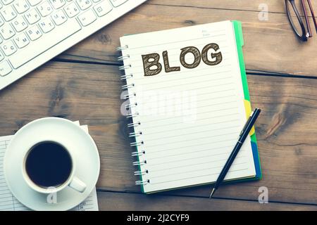 blog word on notepad and keyboard on desktop Stock Photo