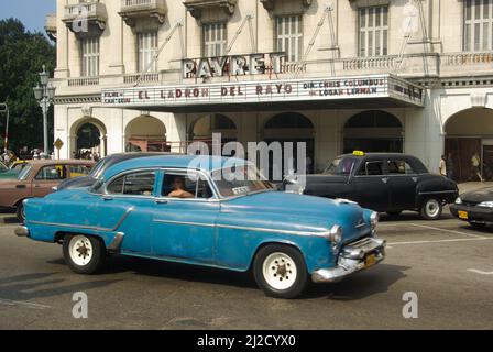 Havana, Cuba, May 29, 2010, Old American car in front of the famous Payret cinema Stock Photo