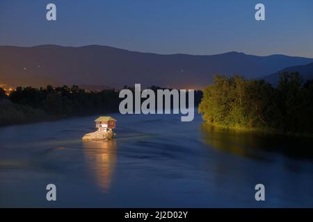 wooden house on a rock of Drina River by night, Serbia Stock Photo