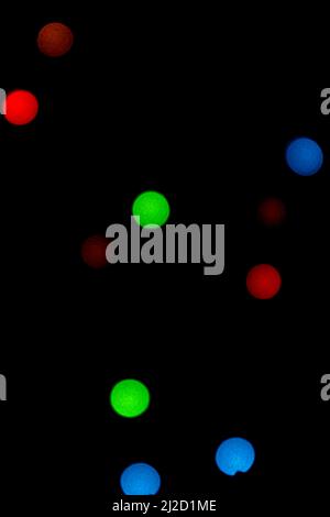 Abstract image of some colored lights in the form of circles on a black background Stock Photo