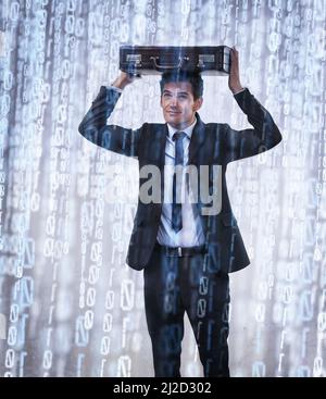 Binary downpour. Studio concept shot of a businessman being rained on by binary code. Stock Photo