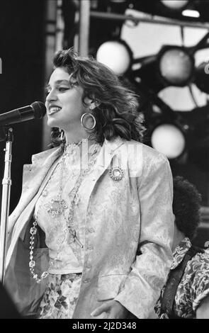 Live Aid dual venue benefit concert held on 13th July 1985 at Wembley Stadium in London, England, and the John F. Kennedy Stadium in Philadelphia, Pennsylvania, United States. The concerts were organised as a follow up to the Band Aid single 'Do They Know Its Christmas?'  to raise money for victims of the famine in Ethiopia. Picture shows  Madonna performing on stage during the concert in Phildalephia. Stock Photo