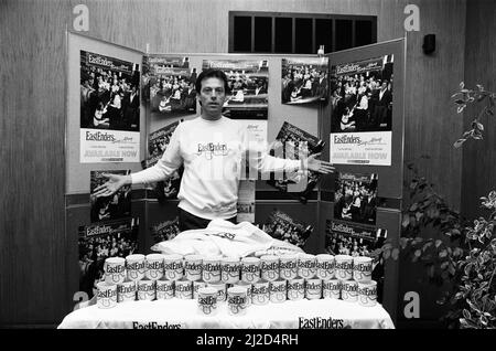 'Dirty Den' aka Leslie Grantham, landlord of the Queen Victoria had a part time job selling EastEnders t-shirts and coffee mugs. 29th November 1985. Stock Photo