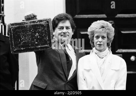 Chancellor of the Exchequer Nigel Lawson outside 11 Downing Street with his wife Therese. 19th March 1985. Stock Photo