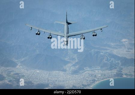 A U.S. Air Force B-52H Stratofortress flies above the Arabian Gulf, March 29, 2022. The bomber’s flight originated at Royal Air Force Fairford, England, and flew over the East Mediterranean, Arabian Peninsula, and Red Sea before departing the region. (U.S. Air Force photo by Staff Sgt. Joseph Pick) Stock Photo