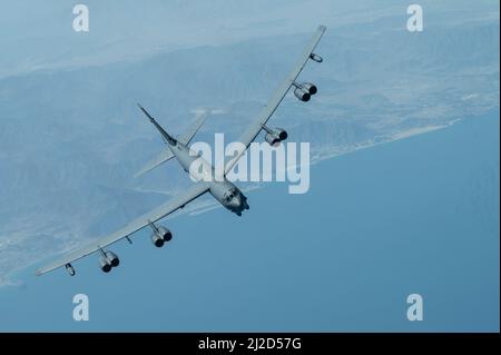 A U.S. Air Force B-52H Stratofortress flies above the Arabian Gulf, March 29, 2022. The bomber’s flight originated at Royal Air Force Fairford, England, and flew over the East Mediterranean, Arabian Peninsula, and Red Sea before departing the region. (U.S. Air Force photo by Staff Sgt. Joseph Pick) Stock Photo