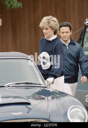 Princess Diana, the Princess  of Wales, at  Smith's Lawn, Windsor  to watch her husband take part in a polo match  at Guards Polo Club, accompanied by Charles 'Les Diables Bleus' teammate Guy Wildenstein. 25th May 1986. Stock Photo