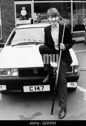 Stephen Hendry poses with his Volkswagen Scirocco GT, the 120mph car was bought in a special deal with a Glasgow firm.At 16 the up and coming star of Scottish snooker is too young to drive! its' a bit of a nuisance said Stephen the youngest ever professional snooker player. 10th January 1985 Stock Photo