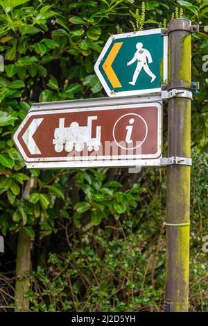 Snowdonia,North Wales,UK-March 17th 2022: Two signs show directions to the nearby train halt,used by tourists to ride up to Mount Snowdon. Stock Photo