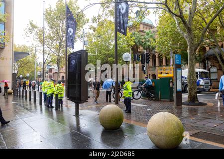 Australian police officers in Sydney watch over a small protest at NSW Parliament House,Sydney,Australia Stock Photo