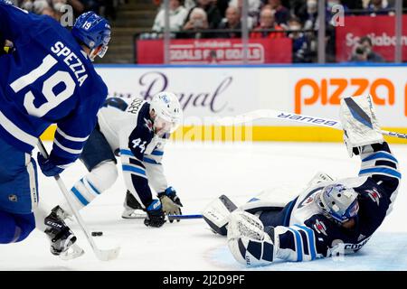 May 1, 2022, WINNIPEG, MANITOBA, CANADA: Winnipeg Jets' goaltender Eric  Comrie (1) celebrates the win over the Seattle Kraken with Dylan DeMelo (2)  during NHL action in Winnipeg on Sunday May 1