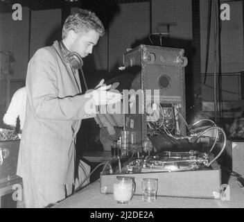 Former Specials keyboard player Jerry Dammers stepped in as DJ at the Cov Aid concert at the Lanchester Polytecnic in aid of famine relief in Ethiopia and Sudan.19th October 1985 Stock Photo