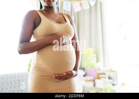 Premium Photo  Young african pregnant woman touching her belly outdoor at  city park focus on face