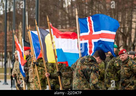 Vilnius, Lithuania - March 29 2022: Flags of various European countries members of NATO force integration unit, close up Stock Photo