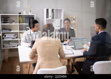 Diverse Business People Discussions In Office. Group Meeting Stock Photo