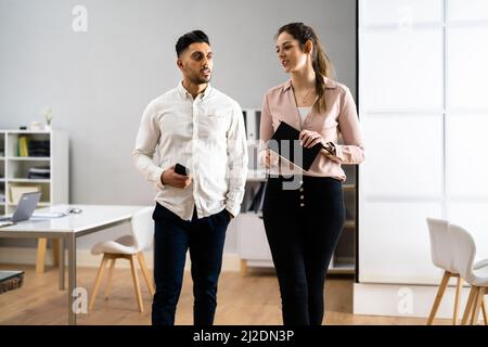 Two Business People Talking. Teamwork And Planning Stock Photo