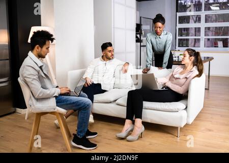 Young Diverse People Using Laptops In Coworking Space Stock Photo