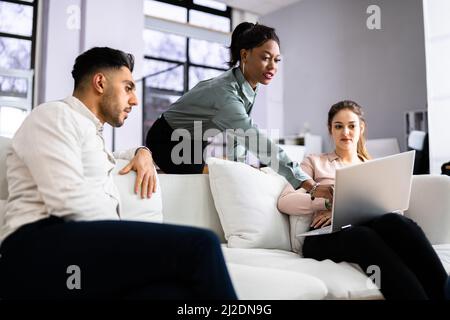 Young Diverse People Using Laptops In Coworking Space Stock Photo