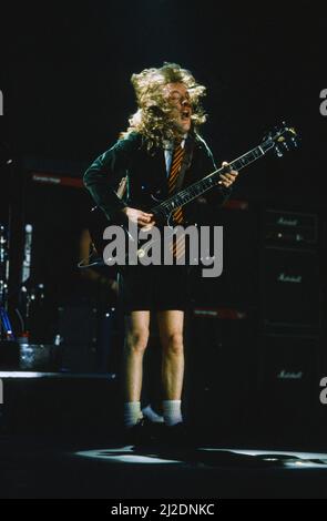 Australian rock group AC/DC performing on stage at Wembley Arena  during their 'Fly On The Wall ' World tour. Pictured is guitarist Angus Young. 16th January 1986. Stock Photo