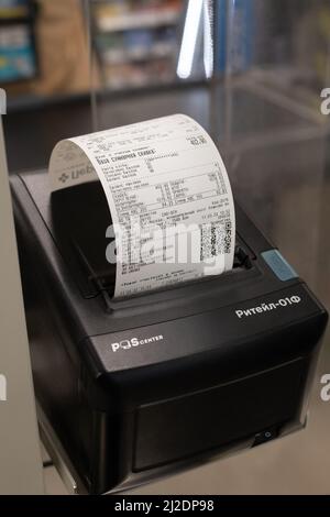 Moscow, Russia - 11 March 2022. Cash receipt in the payment terminal in the Perekrestok store Stock Photo
