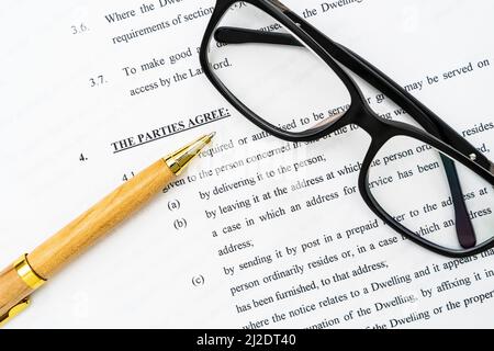 Residential Lease Agreement with a pen and glasses Stock Photo