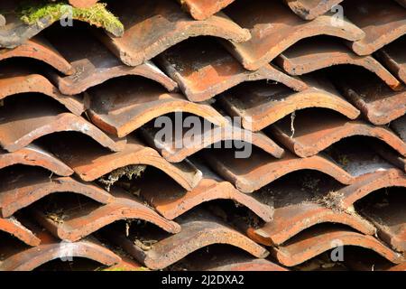 a pile of single pantiles terracotta in colour Stock Photo