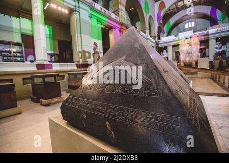 Ancient Stone Exhibits in the View of Small Pyramids with Hieroglyphics in the Cairo Egyptian Museum, the oldest archaeological museum in the Middle E Stock Photo