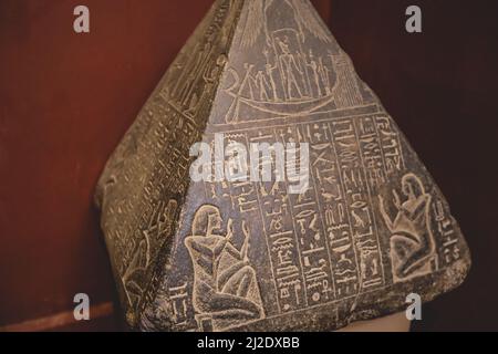 Ancient Stone Exhibits in the View of Small Pyramids with Hieroglyphics in the Cairo Egyptian Museum, the oldest archaeological museum in the Middle E Stock Photo