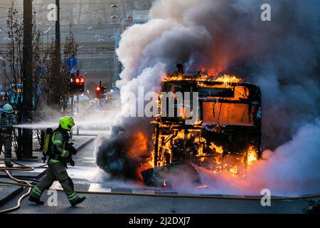 Oslo, Norway. 31st Mar, 2022. Oslo 20220331.The fire brigade is putting out a large fire in a bus outside Oslo city shopping centre on Thursday night. Photo: Håkon Mosvold Larsen/NTB Credit: NTB Scanpix/Alamy Live News Stock Photo