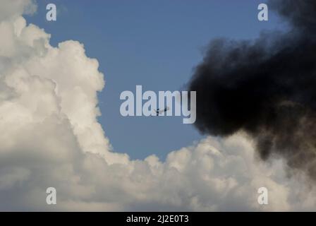 Royal Air Force Role Demo air power demonstration, illustrating the use of air power in modern warfare. Boeing E-3 Sentry through pyrotechnic smoke Stock Photo