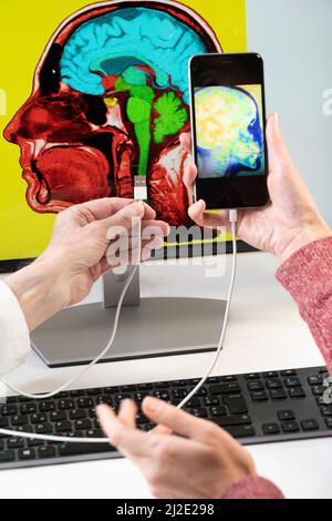Mobile Computer Brain human brain inside a computer monitor Stock Photo - Alamy