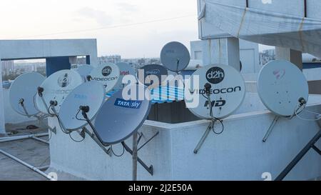 Different Dish TV antenna on terrace, Pune, Maharashtra, India Stock Photo
