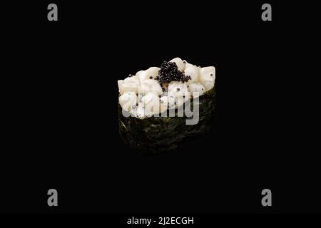 japanese gunkan with scallop, tobiko caviar, spicy sauce, rice on isolated black background, japanese menu. Stock Photo