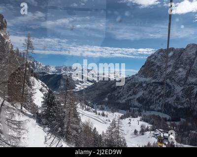 The Snowy Italian Alps Mountains: view from inside a Cabin of a Cableway. Stock Photo