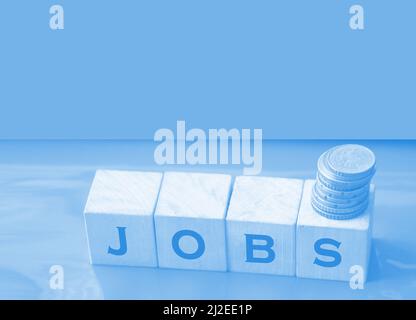 JOBS word made with building blocks on red. Business concept. Stock Photo