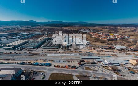 Train station of Grosuplje in Slovenia is being renovated. Visible new track layout and work trains on the tracks on a sunny day. Stock Photo