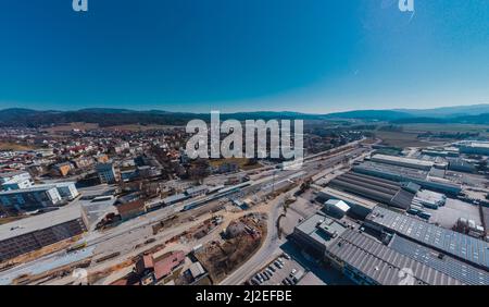 Train station of Grosuplje in Slovenia is being renovated. Visible new track layout and work trains on the tracks on a sunny day. Stock Photo