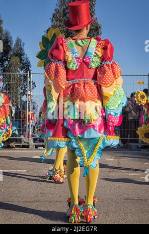 Portugal Carnival, Rear view of costume with top hats and frills from Silver Coast - 'An open-air opera - Parintins Festival.Ovar, Grande Desfile. Stock Photo