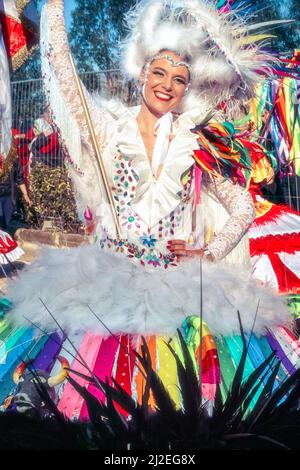 Portugal Carnival - colourful, smiling woman in costume Ovar, Grande Desfile or. Big Parade, 'An open-air opera' - Parintins Festival. Stock Photo